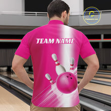Load image into Gallery viewer, Front view of a male model at the bowling lane wearing a quarter zip shirt with bowling ball and pins flowing through a pink gradient layout.