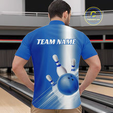 Load image into Gallery viewer, Male model front view at the bowling lane wearing a bowling quarter zip shirt with bowling ball and pins flowing across a blue gradient design.