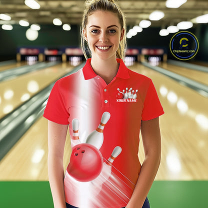 Front view of a female model in a bowling lane wearing a bowling polo shirt with bowling ball and pins flowing through a red gradient design.