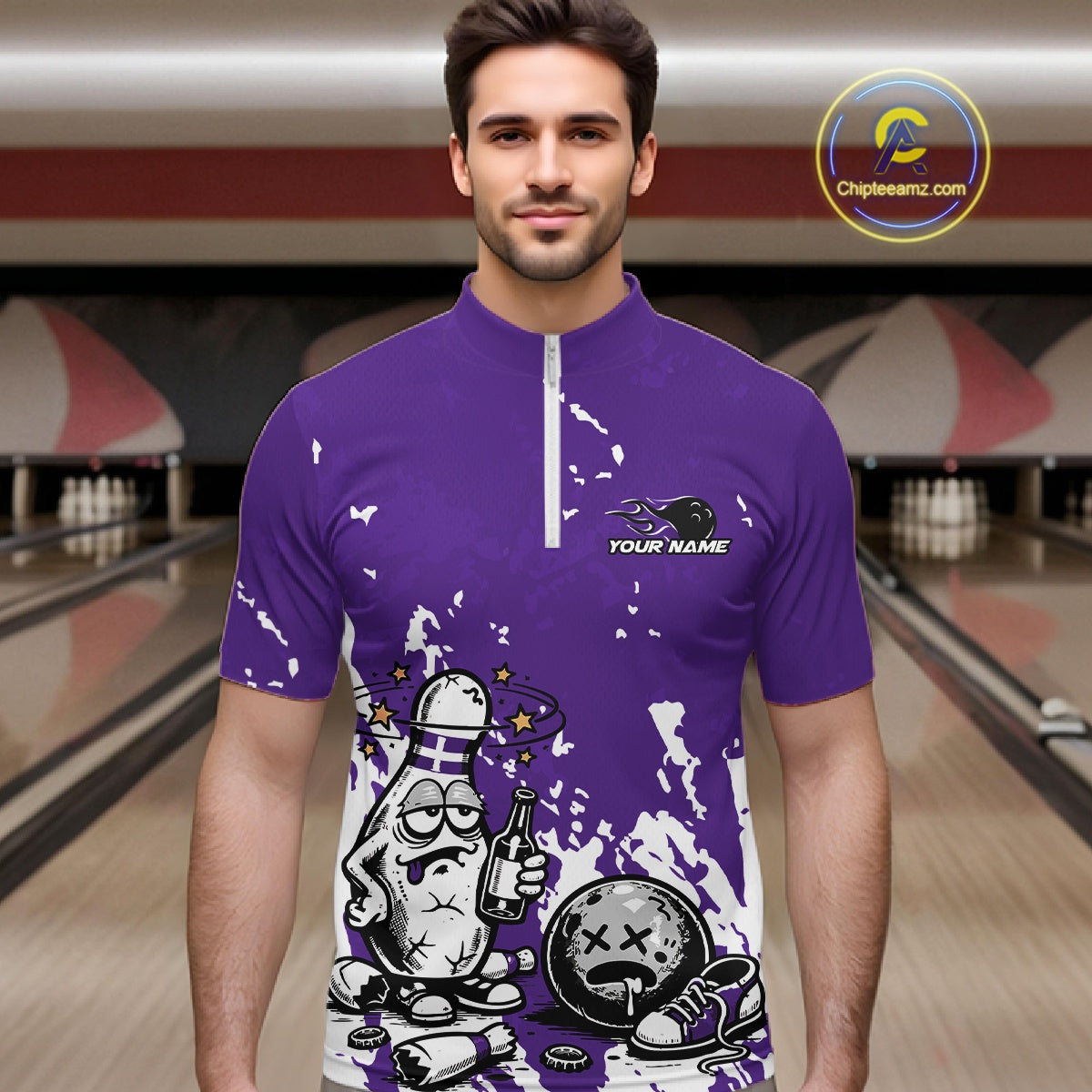 Male model in a bowling lane wearing a purple and white quarter-zip shirt, splatter-style humorous bowling pin illustration with beer bottle and ball.