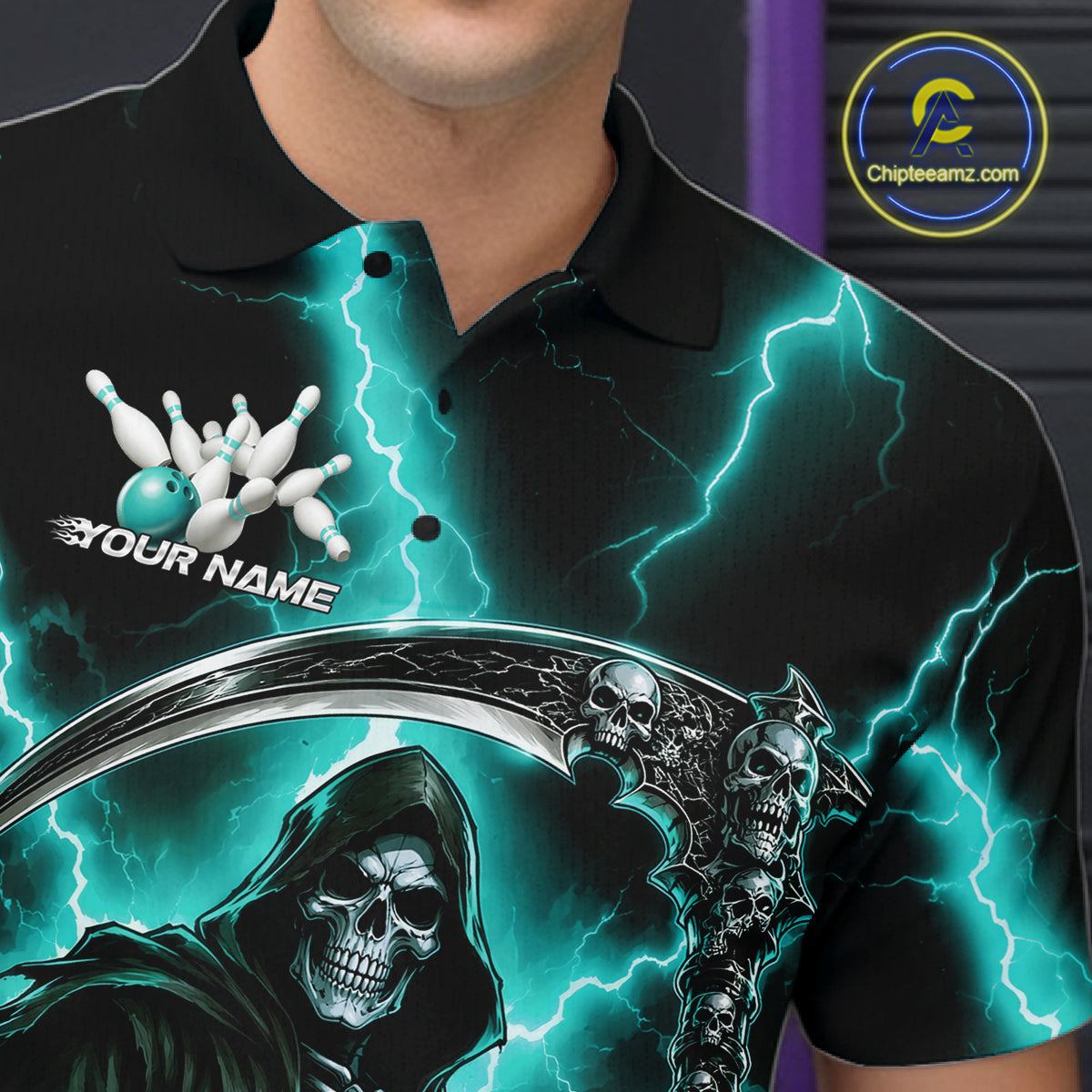 A close-up of a person wearing a black short-sleeve polo shirt with a vivid graphic print. The design features teal lightning bolts, a grim reaper skull and scythe, bowling pins, and the text 'YOUR NAME' with a bowling ball.