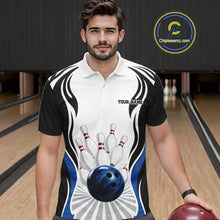 Load image into Gallery viewer, Male model at a bowling lane wearing a white, black, and blue bowling polo shirt, front view, with bowling ball and pins graphics.