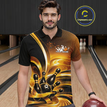 Load image into Gallery viewer, Front view of a male model at a bowling lane wearing a bowling polo shirt with glossy gold and black bowling ball and pins artwork.