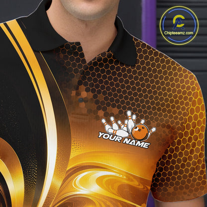 Close-up of the left chest on a bowling polo shirt featuring glossy gold and black bowling ball and pins artwork.