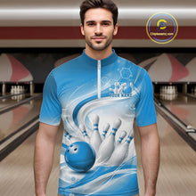 Load image into Gallery viewer, Male model standing in a bowling lane wearing a white and blue bowling quarter-zip shirt featuring abstract wave lines and a glossy bowling ball striking pins on the front.