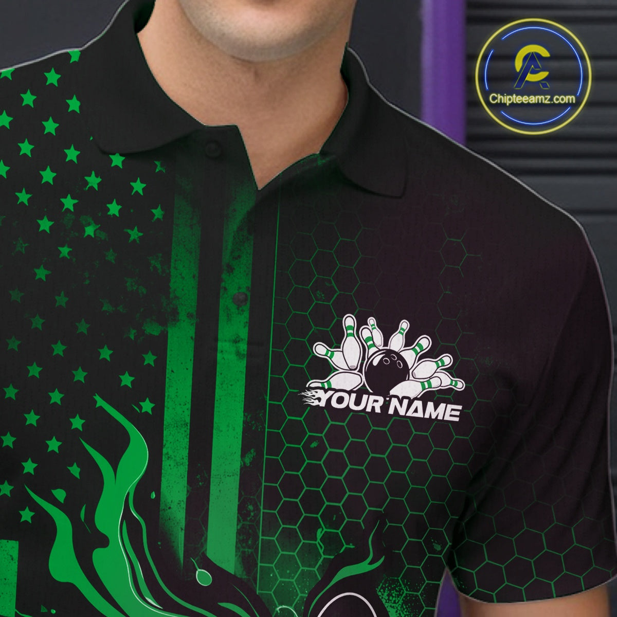 Close-up of a black and green bowling polo shirt left chest showing patriotic flames around a bowling strike motif.