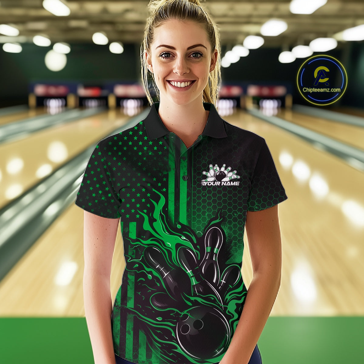 Female model wearing a black and green bowling polo shirt at a bowling lane with bold bowling strike graphics and patriotic accents.