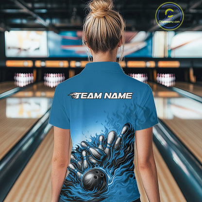 Back view of a female bowler wearing a quarter-zip shirt, raccoon illustration with sunglasses and patriotic bandana beside a bowling ball.