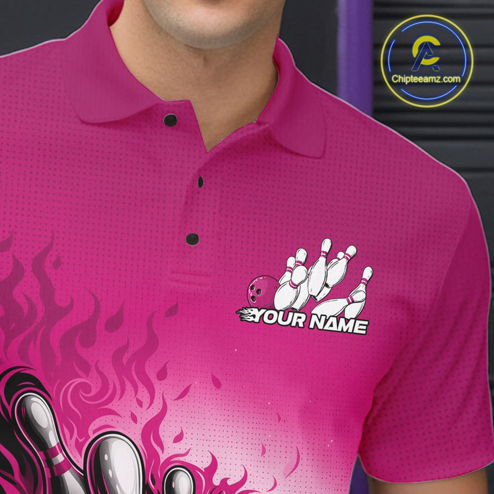 Close-up left chest detail of pink bowling polo shirt featuring flame bowling ball and pins emblem artwork
