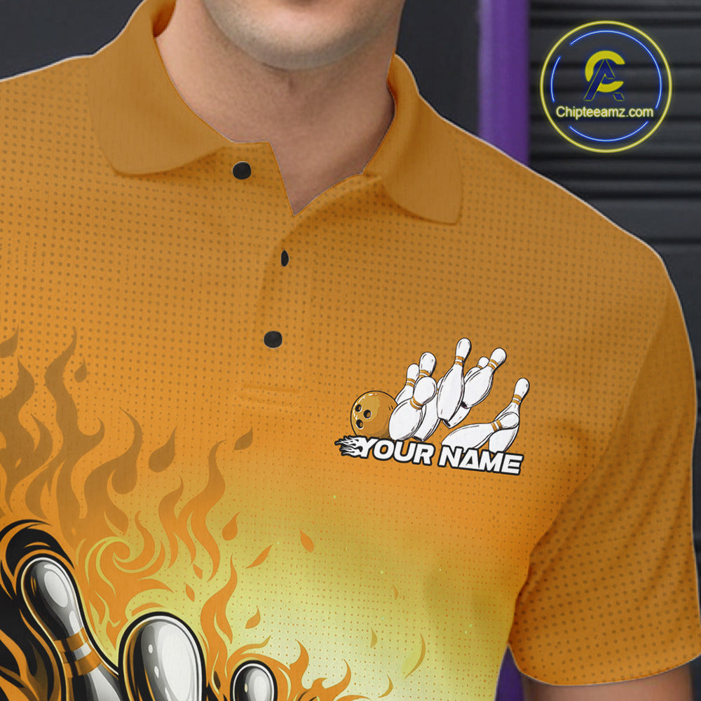 Close-up left chest detail of yellow bowling polo shirt featuring flame bowling ball and pins emblem design