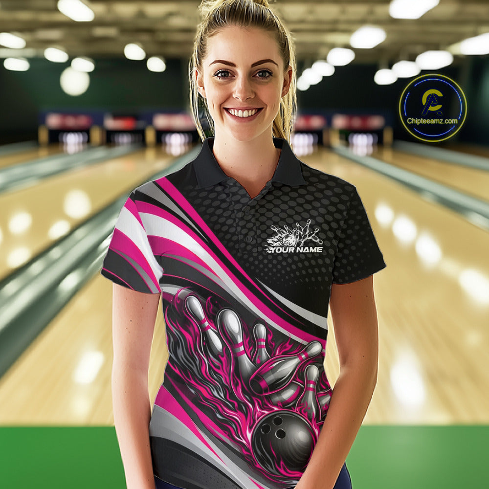 Female model at a bowling lane wearing a black and pink polo shirt, flaming bowling ball hitting pins with bold action-style design.