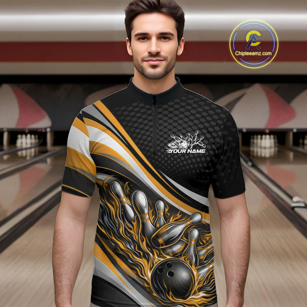 Male model at a bowling lane wearing a black and yellow quarter-zip shirt, flame bowling ball and pins illustration creating an intense strike moment.
