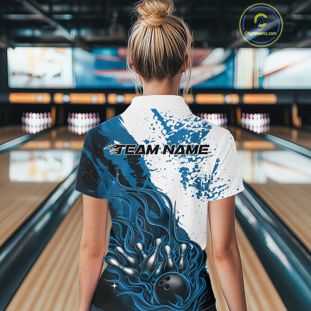 Bowling lane back view female model wearing bowling polo shirt, black blue and white palette, flame bowling ball and pins artwork, athletic promotional setting
