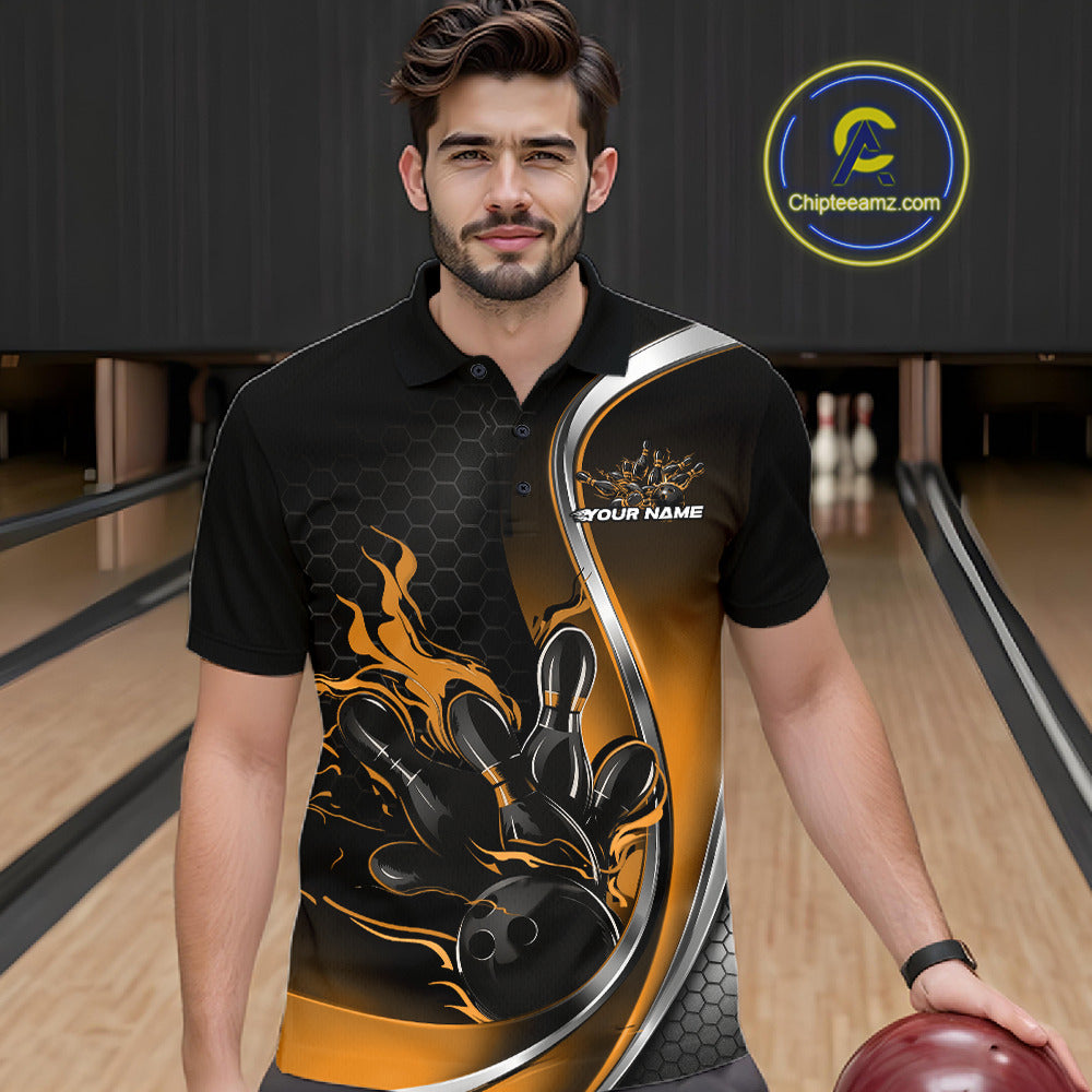 Male model seen from the front in a bowling lane wearing a black and yellow polo shirt featuring a flame bowling ball and pins design in a dynamic sports action scene.
