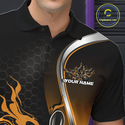 Close-up view of the left chest area of a black and yellow bowling polo shirt showing a flame bowling ball and pins design detail.
