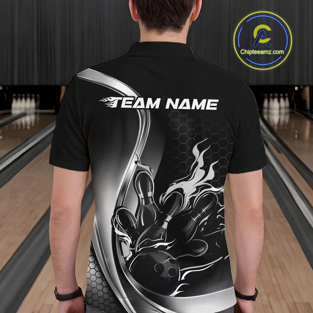 Male model seen from the back in a bowling lane wearing a black and gray polo shirt featuring a flame bowling ball and pins design in a dynamic sports scene.