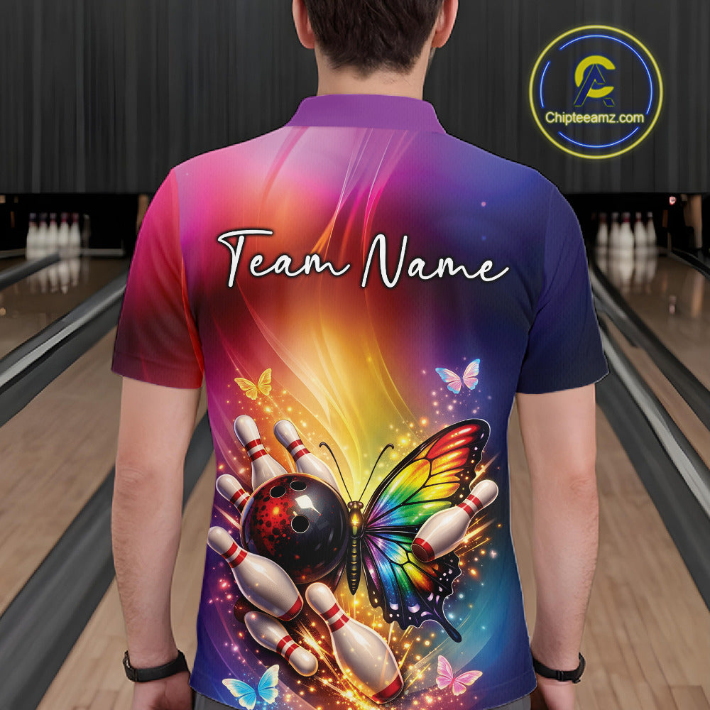 Back view of a male model in a bowling center wearing a bowling polo shirt showcasing a rainbow butterfly beside a bowling ball and pins.