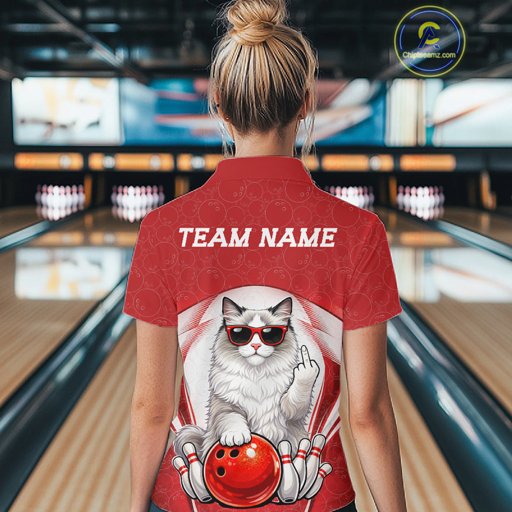 Back view of a female model at a bowling lane wearing a white and red bowling quarter-zip shirt featuring a ragdoll cat and bowling ball motif.