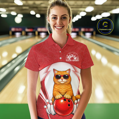 Female model at a bowling lane wearing a white and red bowling polo shirt with an orange British Shorthair cat and bowling ball artwork.