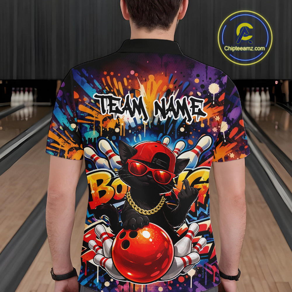 Back view of a male model in a bowling venue wearing a bowling polo shirt featuring a black cat in sunglasses leaning on a bowling ball.