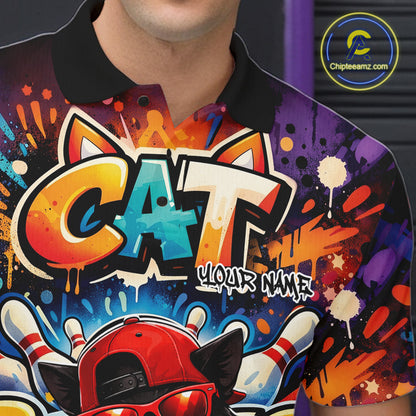 Close-up of the left chest on a colorful bowling polo shirt featuring a graffiti-style black cat wearing sunglasses and a backward cap beside a bowling ball.