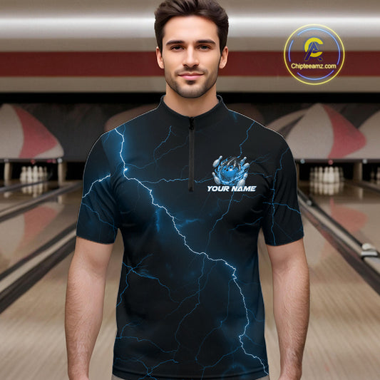 Male model wearing a black and blue bowling quarter-zip with fantasy dragon claw artwork and lightning-inspired graphics.