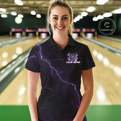 Female model wearing a black and purple bowling polo in a bowling center with dragon claw and bowling pin graphics.