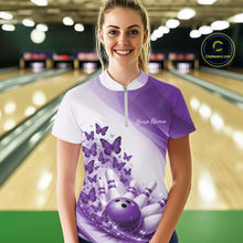 Load image into Gallery viewer, Female model wearing a white and purple bowling quarter zip with butterfly graphics and bowling artwork, front view at the bowling lane