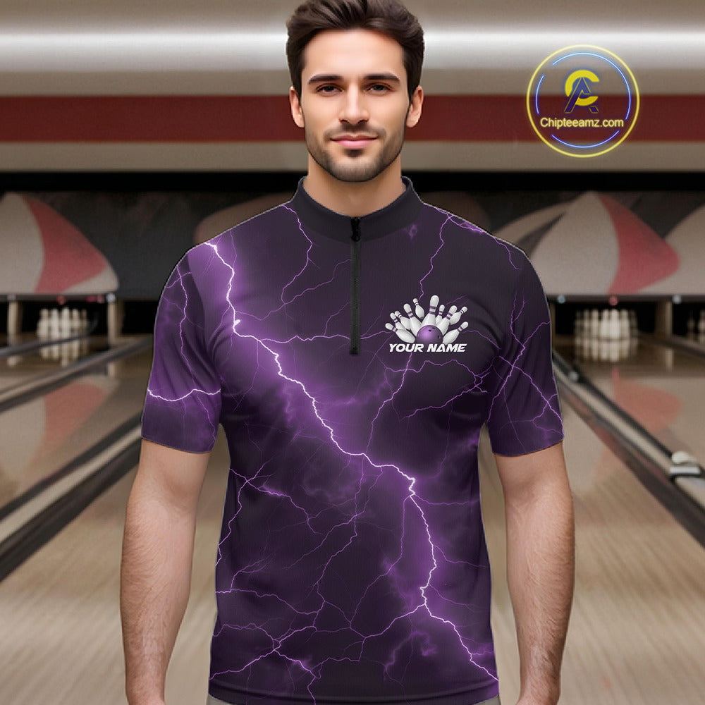 Male model wearing a bowling quarter-zip in a bowling lane with a purple cobra coiled around a bowling ball, scattered pins, and lightning fantasy artwork.