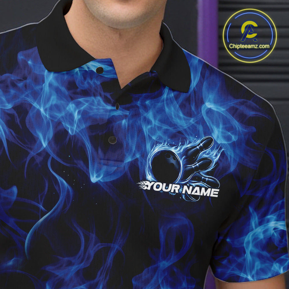Close-up left chest detail of a blue bowling polo featuring a bowling ball encircled by flames.