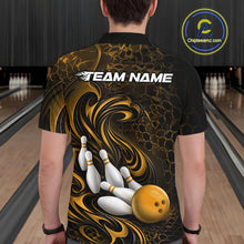 Load image into Gallery viewer, Back view of a male model wearing a black and yellow bowling polo shirt in a bowling alley featuring a tribal flame bowling ball and pins graphic
