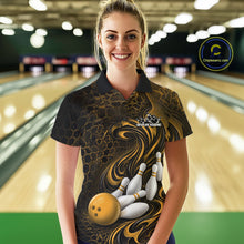 Load image into Gallery viewer, Female model wearing a black and yellow bowling polo shirt in a bowling alley featuring a tribal flame bowling ball and pins graphic