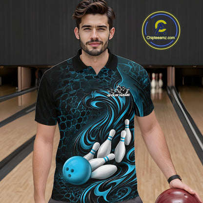Male model standing in a bowling lane wearing a black and blue bowling polo shirt featuring a tribal flame bowling ball and pins graphic on the front.