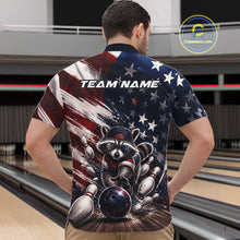 Load image into Gallery viewer, Bowling shirt featuring a raccoon in patriotic sunglasses rolling a bowling ball through scattered pins with a distressed American flag backdrop.