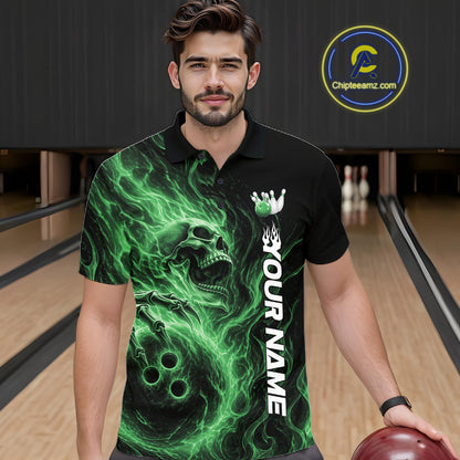 Male model wearing a black bowling polo shirt in a bowling alley featuring a skull clutching a bowling ball surrounded by swirling green energy flames