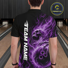 Load image into Gallery viewer, Back view of a male bowler in a bowling alley wearing a black bowling polo shirt featuring a purple energy-flame skull clutching a bowling ball