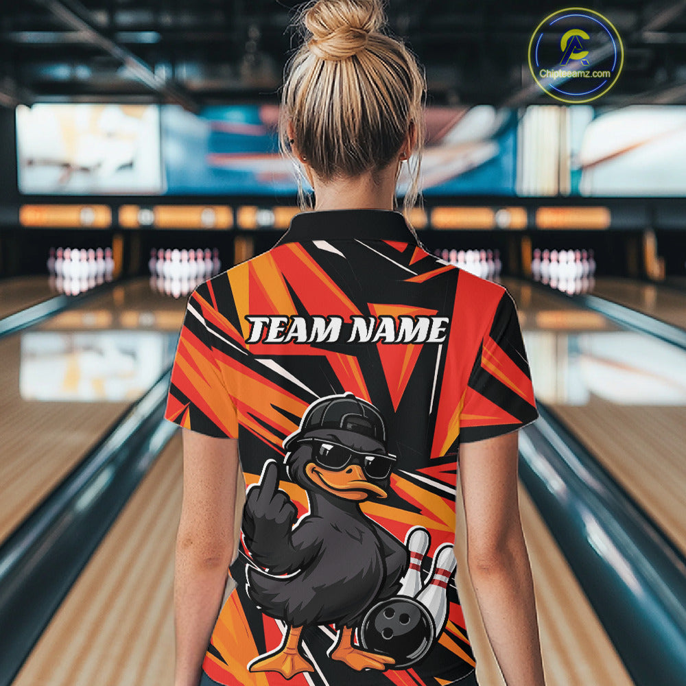 Back view of a female model in a black and orange bowling quarter-zip featuring duck-themed bowling graphics and geometric patterns.