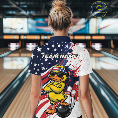 Back view female model in bowling lane wearing quarter-zip shirt featuring patriotic duck sunglasses beside bowling ball design