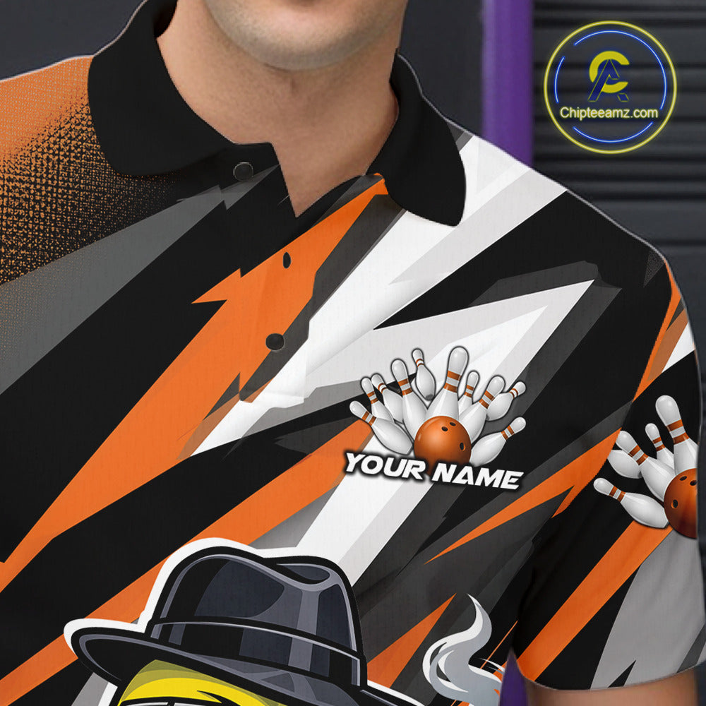 Left chest close-up of a black and orange bowling polo featuring a duck, bowling ball, and pin motif.