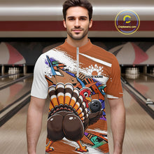 Load image into Gallery viewer, Front view of a male model wearing an orange custom quarter zip bowling shirt with a funny graffiti turkey holding a bowling ball, paint splatter accents in a bowling alley.