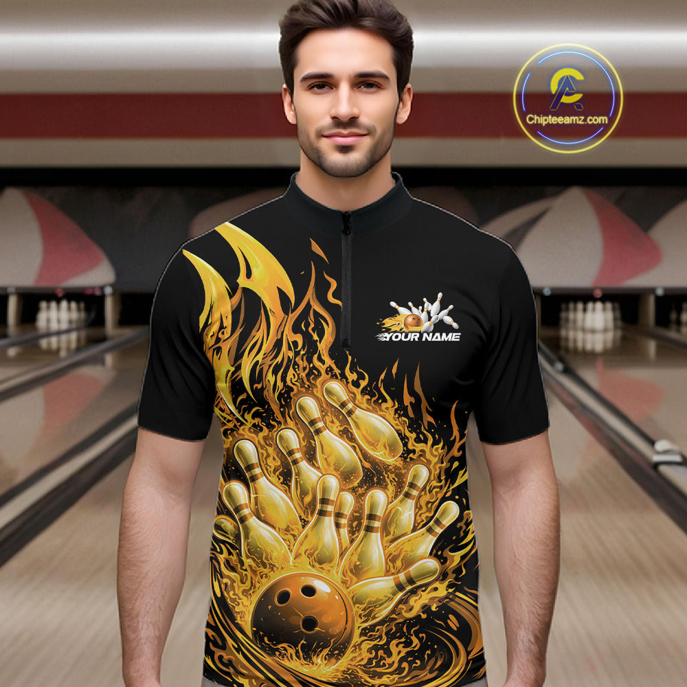 Male model in bowling lane wearing quarter-zip shirt with flaming bowling ball striking pins yellow flame sports graphics