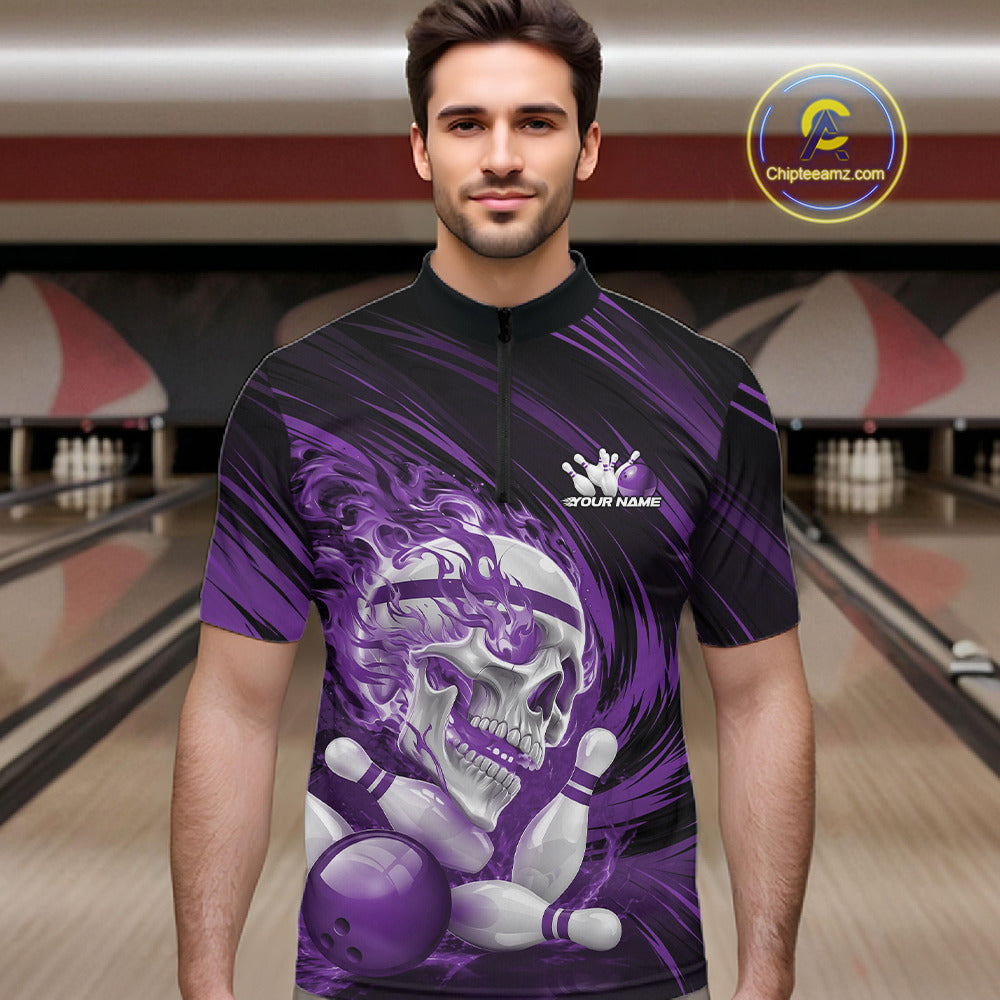 Man wearing a purple and black bowling shirt with a skull design in a bowling alley.