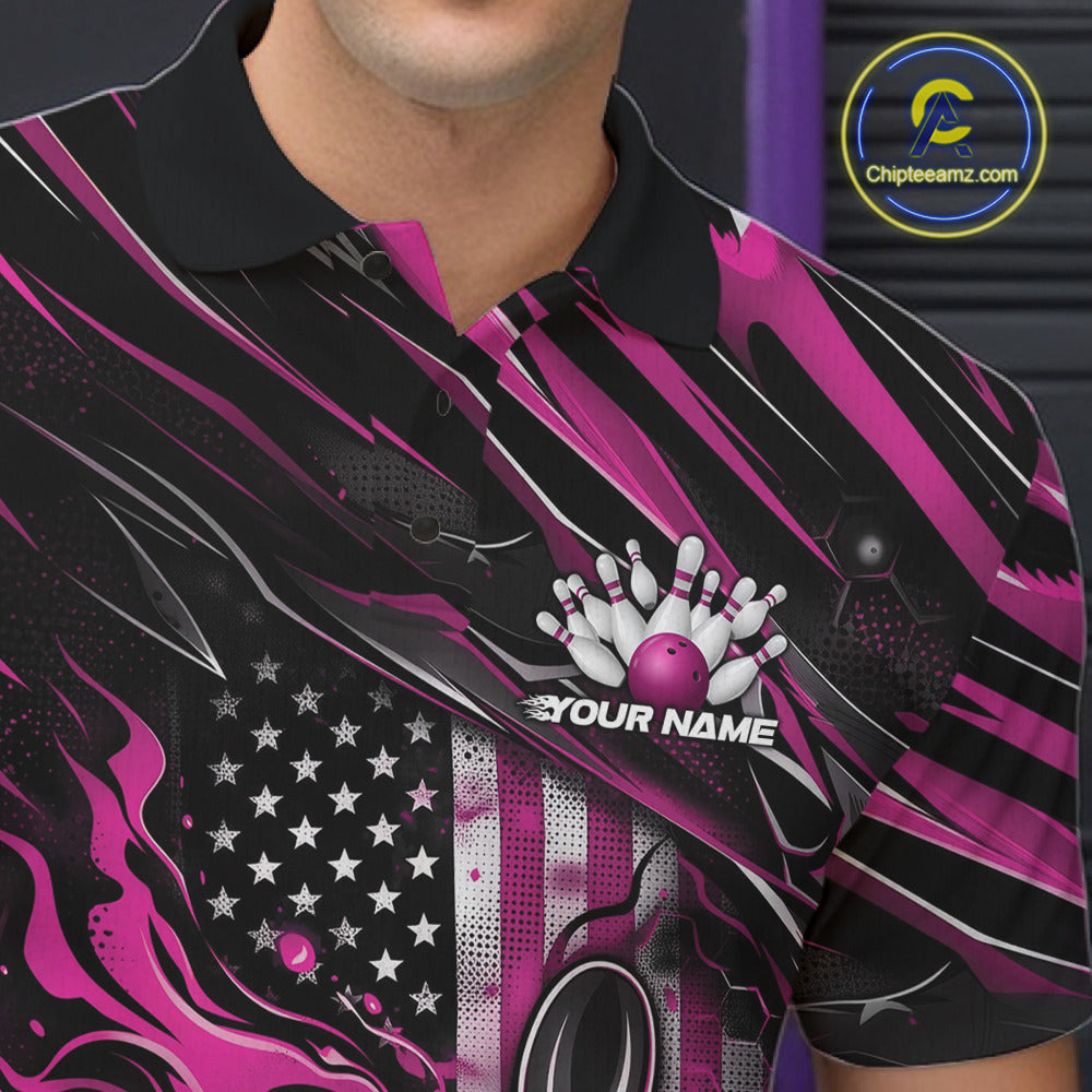 Close-up left chest view of a black and pink bowling polo shirt featuring a patriotic flaming bowling ball striking pins with flag-inspired details.
