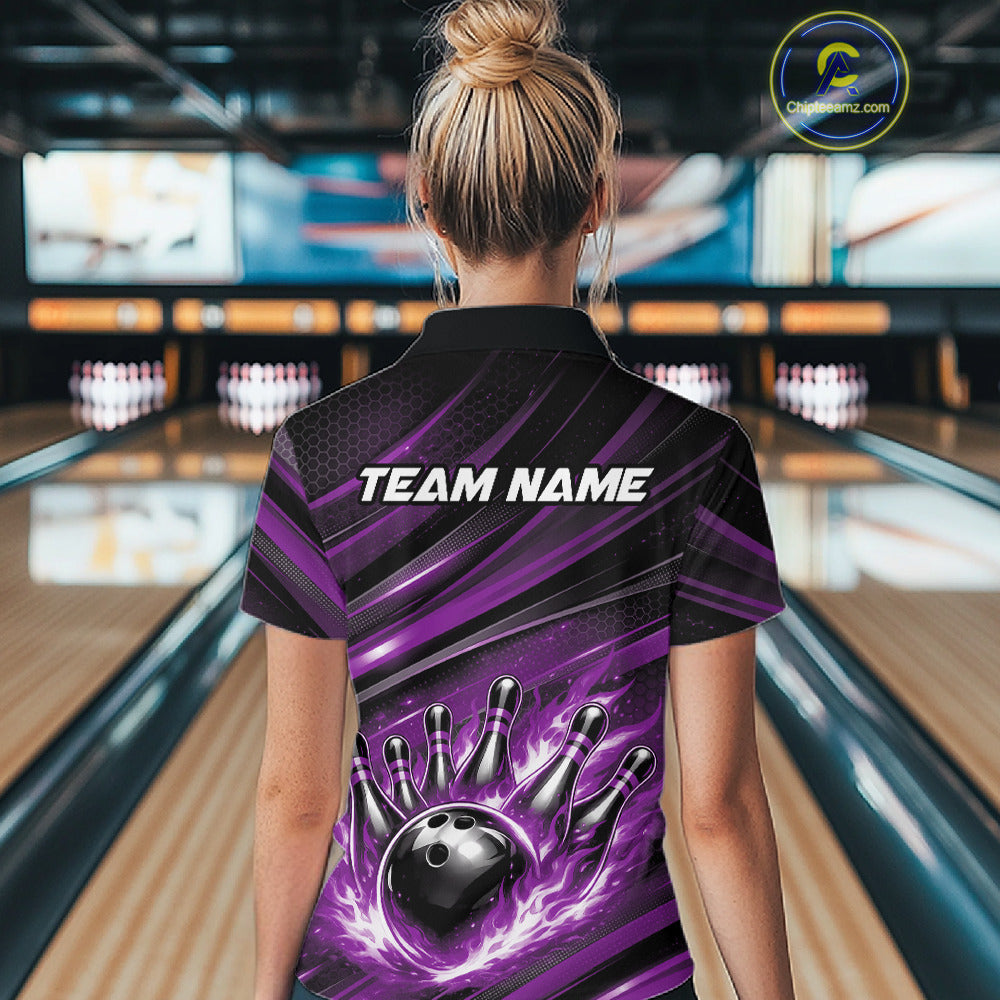 Back view of a female model in a bowling venue wearing a black and purple polo shirt featuring a bowling strike graphic with flame effects.