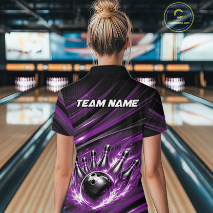 Back view of a female model in a bowling venue wearing a black and purple polo shirt featuring a bowling strike graphic with flame effects.