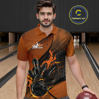 Male model at a bowling lane wearing a black and orange bowling polo shirt with fiery bowling action graphics and hexagonal accents.
