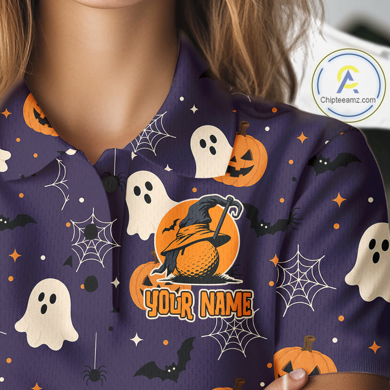 A close-up of a person wearing a purple Halloween-themed collared shirt with a printed pattern of ghosts, pumpkins, bats, and spiderwebs, featuring a customizable orange circle with the text 'YOUR NAME'.