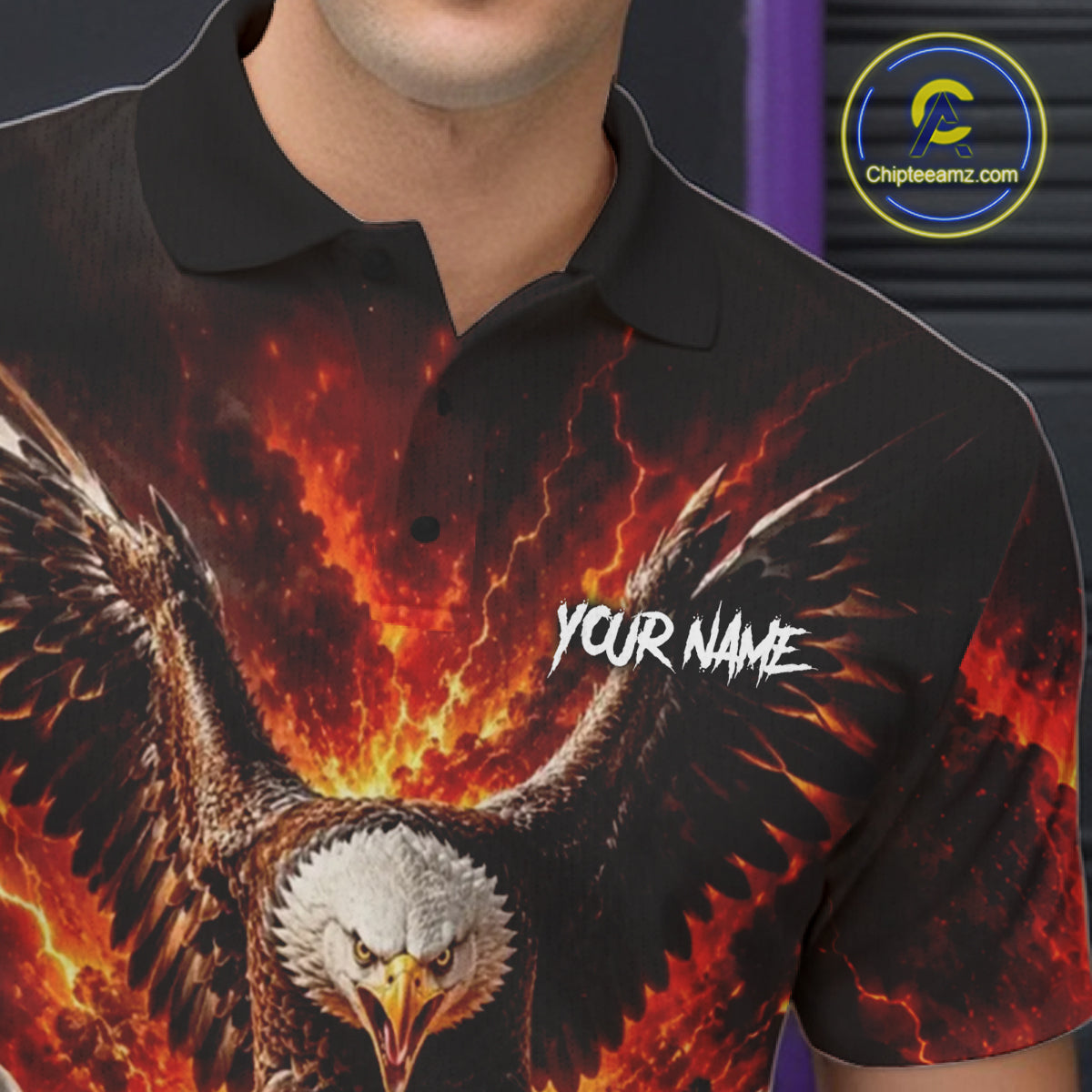 Black polo shirt with fiery eagle design and 'Your Name' text, brand logo visible.
