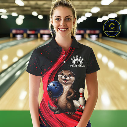 A woman stands in a bowling alley wearing a black short-sleeve polo shirt with a red diagonal graphic, an otter holding a blue bowling ball, bowling pins, and a white 'YOUR NAME' placeholder on the chest. A circular 'ChipTEEamz.