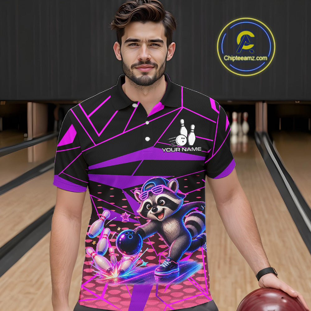 Man wearing a colorful bowling shirt with a raccoon graphic in a bowling alley.